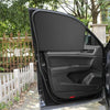 A black car window with a dark gray magnetic sunshade deployed, showing the interior panel.