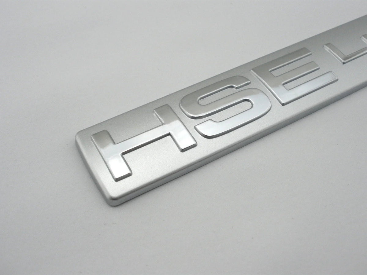 Silver HSEL lettering badge for a car decal
