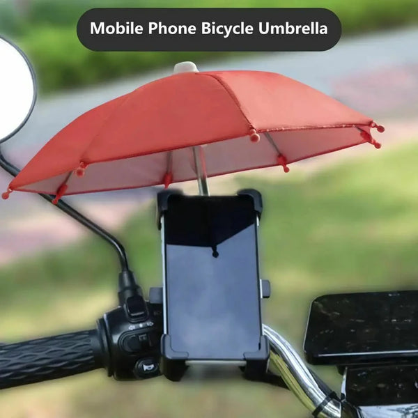 A red umbrella is mounted on a bicycle handlebar, shading a smartphone.