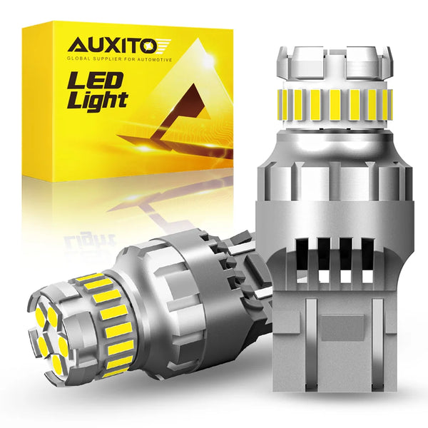 A package of AUXITO LED Light bulbs and a silver automotive light bulb are displayed.