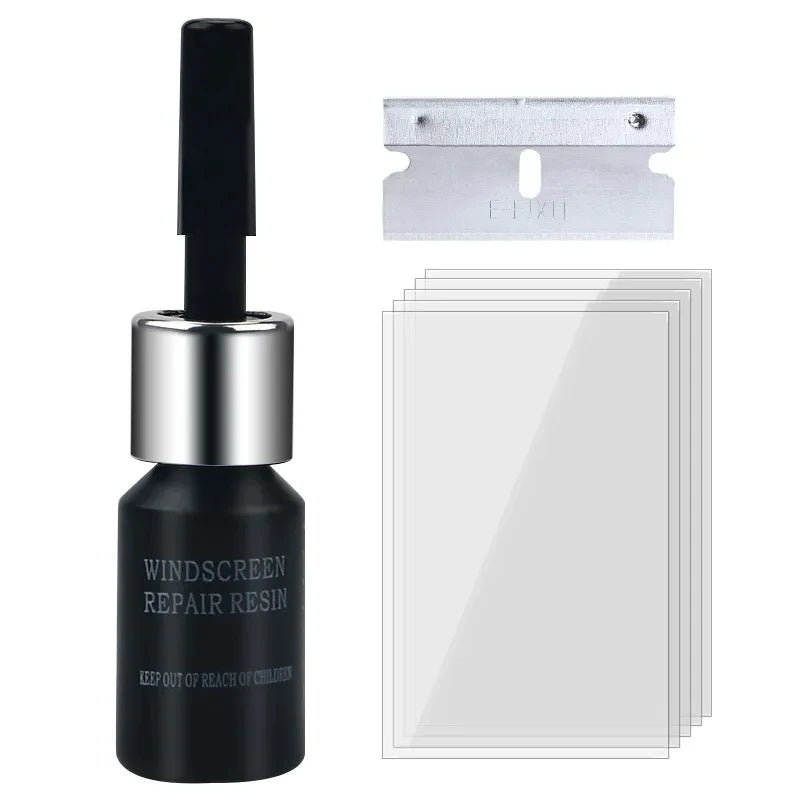A black glass bottle containing windshield repair resin and a metal applicator tool.