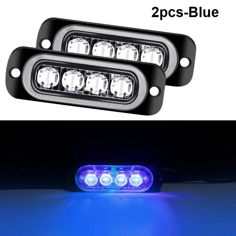 Deux lumières d'avertissement doubles bleues à stroboscope montées dans un boîtier, affichant une illumination bleue vive.