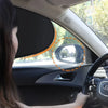 A woman is driving a car, and an electrostatic sun visor is visible on the side window.