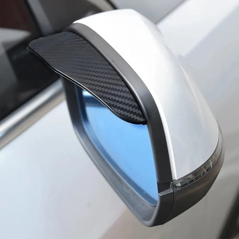 A white carbon fiber car rain visor set is shown mounted on a vehicle's rearview mirror.
