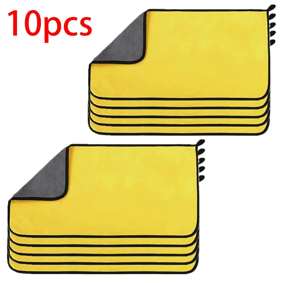 A set of ten yellow and gray microfiber car cleaning towels stacked and displayed.