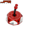 CNC aluminum fuel tank cap for a Honda motorcycle with a red threaded top and silver body.