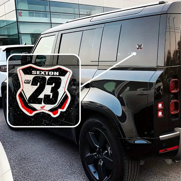 A black SUV features a racing number plate decal set with the number 23 on the rear door.