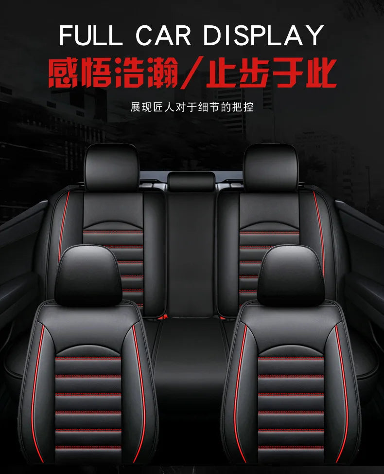 A close-up view of black leather car seat covers with red stitching installed in a vehicle interior.
