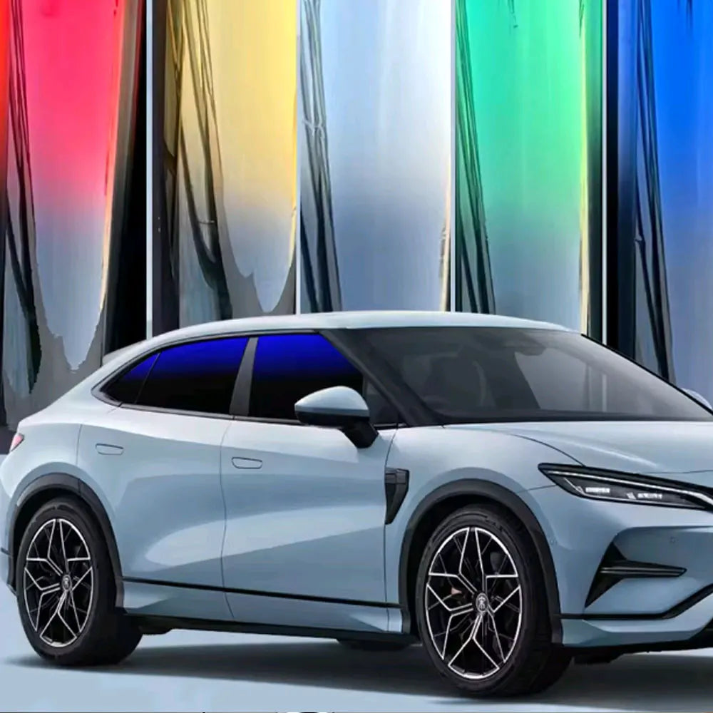 A silver electric sports car with a dark blue window tint, displayed against a colorful gradient background.