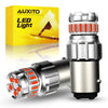 A silver LED light bulb assembly for automotive use shown next to its yellow packaging box.