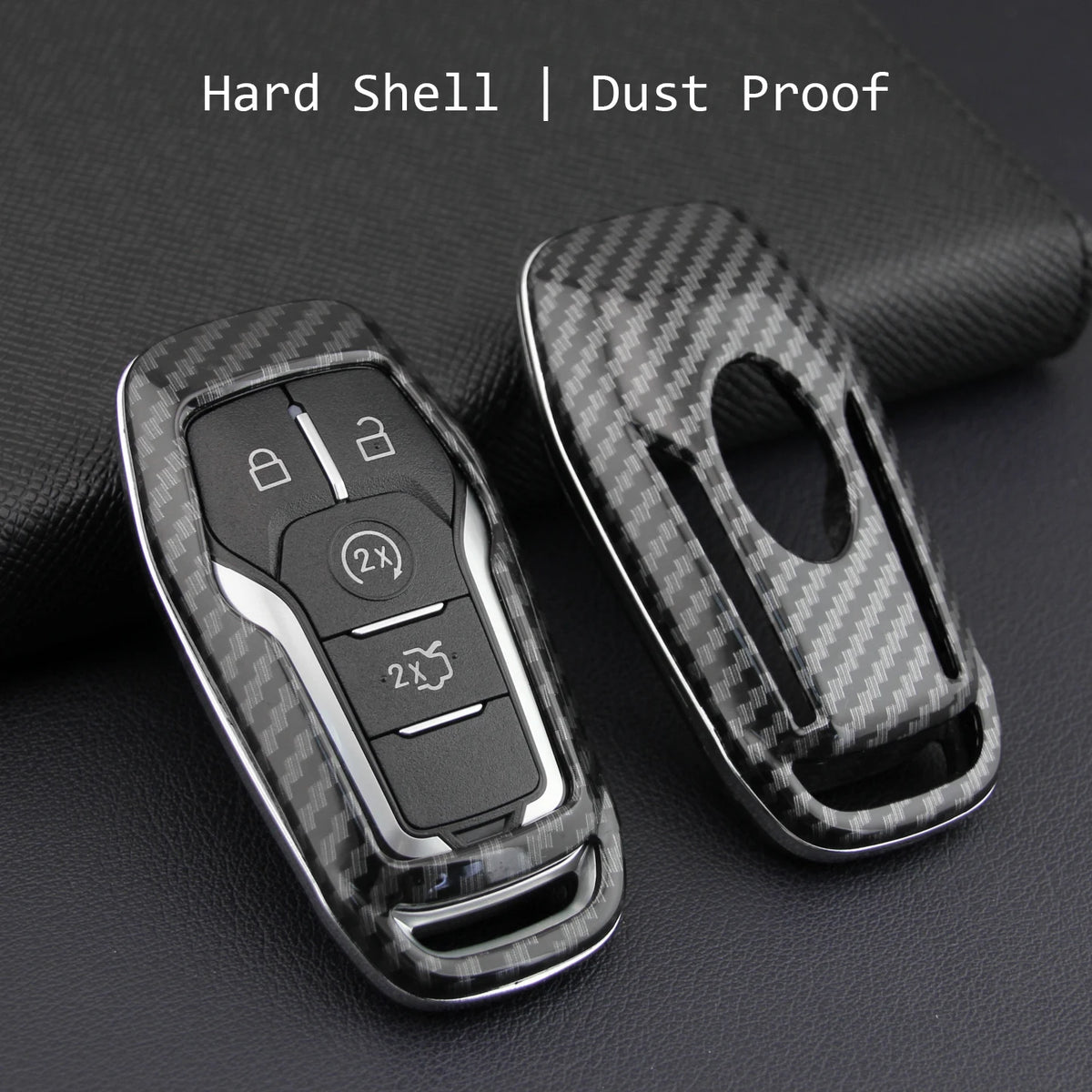 A black carbon fiber style key fob cover with a metal chain, shown against a dark background.