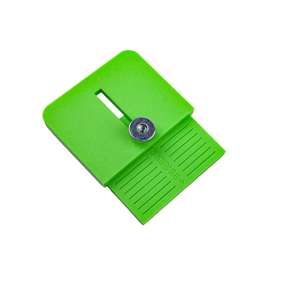 A bright green precision vinyl film edge cutting applicator with a slot and a ribbed surface.