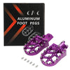 A box and several purple aluminum foot pegs for motorcycles.