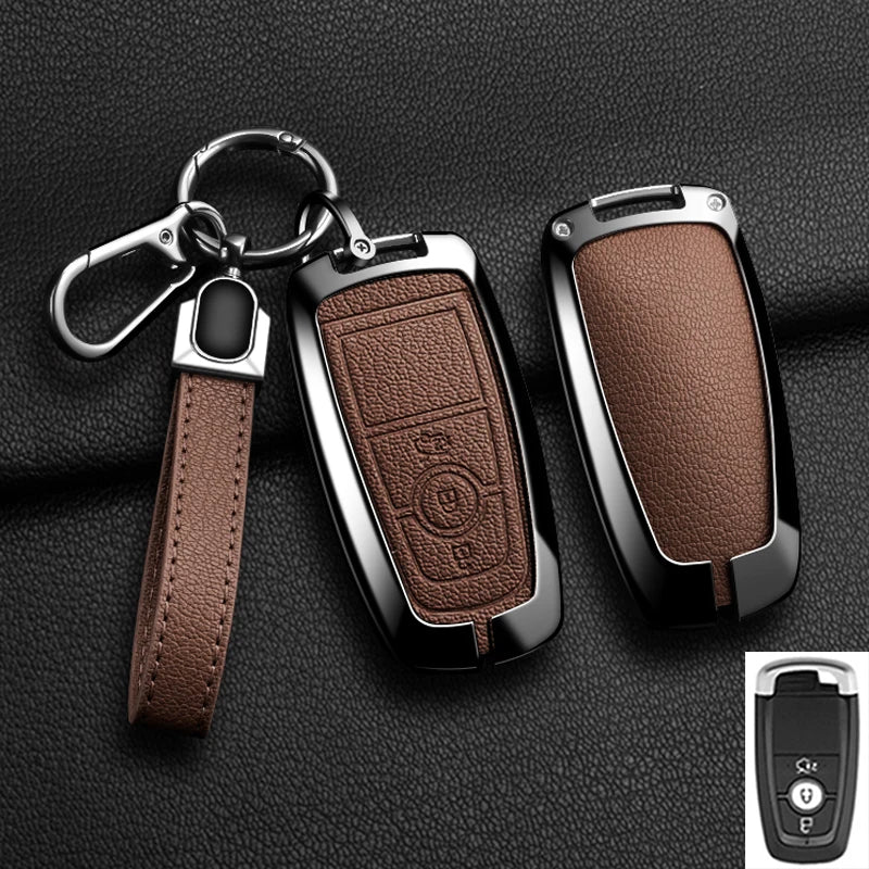 A brown leather strap attached to an aluminum alloy key fob cover for a Ford vehicle.