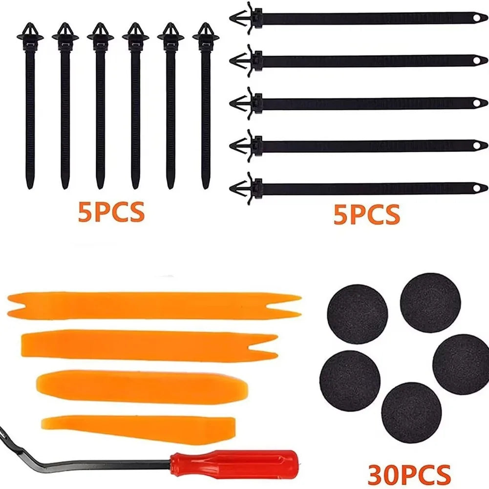 Set of auto fastener clips in black and orange colors with a tool.