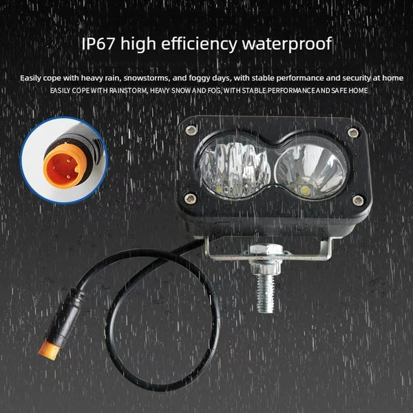 A black IP67 waterproof LED pod spotlight with a wire, shown against a dark background.