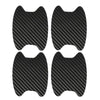A set of car door handle protection film, black and carbon fiber patterned.