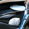A silver sun shade visor protector is shown inside a car's interior door panel.