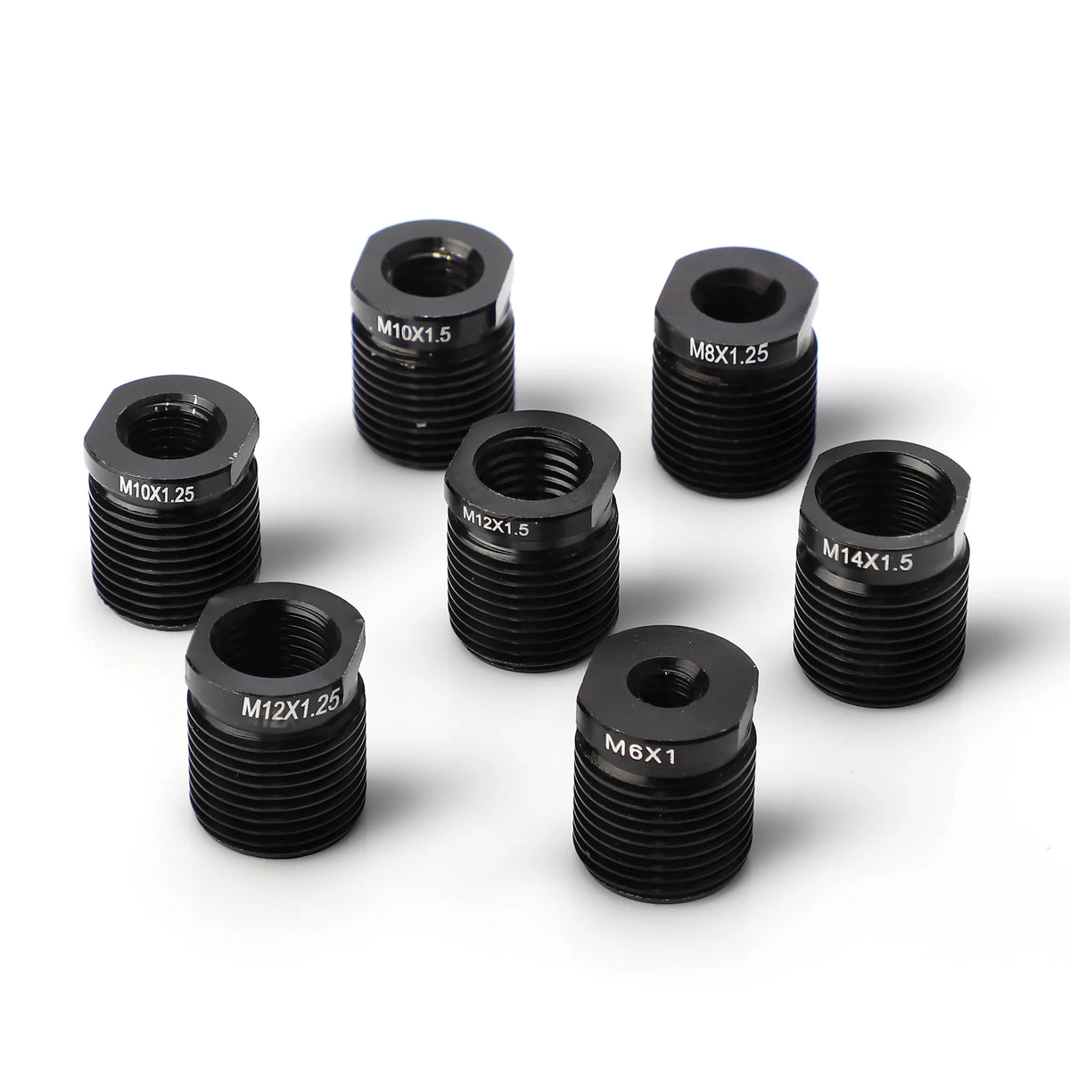 A collection of black universal aluminum shift knob adapters with various metric thread sizes and lengths.