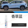 A white automotive touch-up paint pen kit for scratch repair is shown next to a modern SUV.