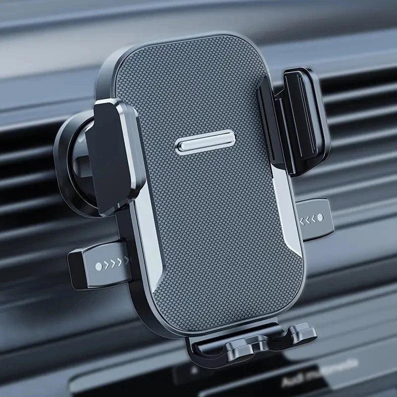 A black universal foldable car phone mount is shown mounted on a dark car grille.