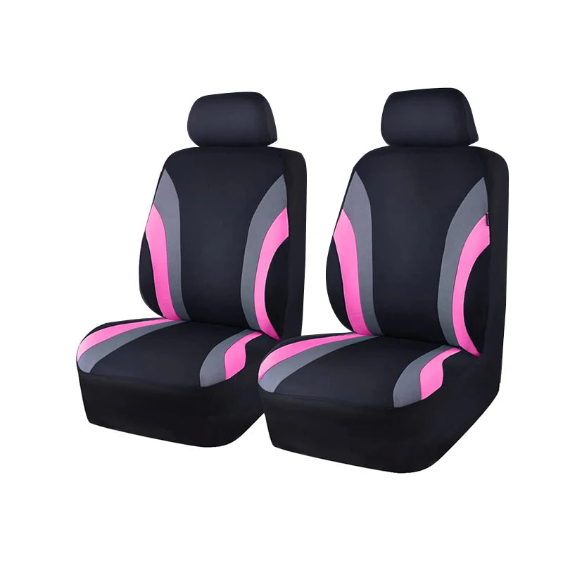 A pair of black car seat covers with pink accents shown from the side.