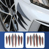 A collection of black and red universal car bumper lip spoiler fins for installation.