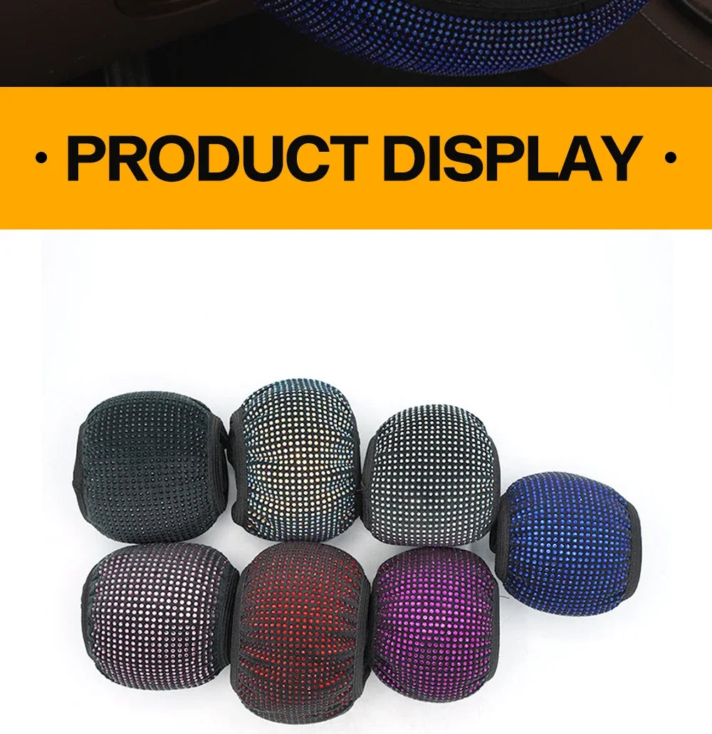 A collection of round rhinestone steering wheel covers in black, silver, red, and purple.