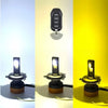 Three Tri-Color LED headlight bulbs are displayed against a yellow background, showing different power levels.