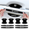 Set of black Honda door handle protection stickers shown next to a white car door handle.