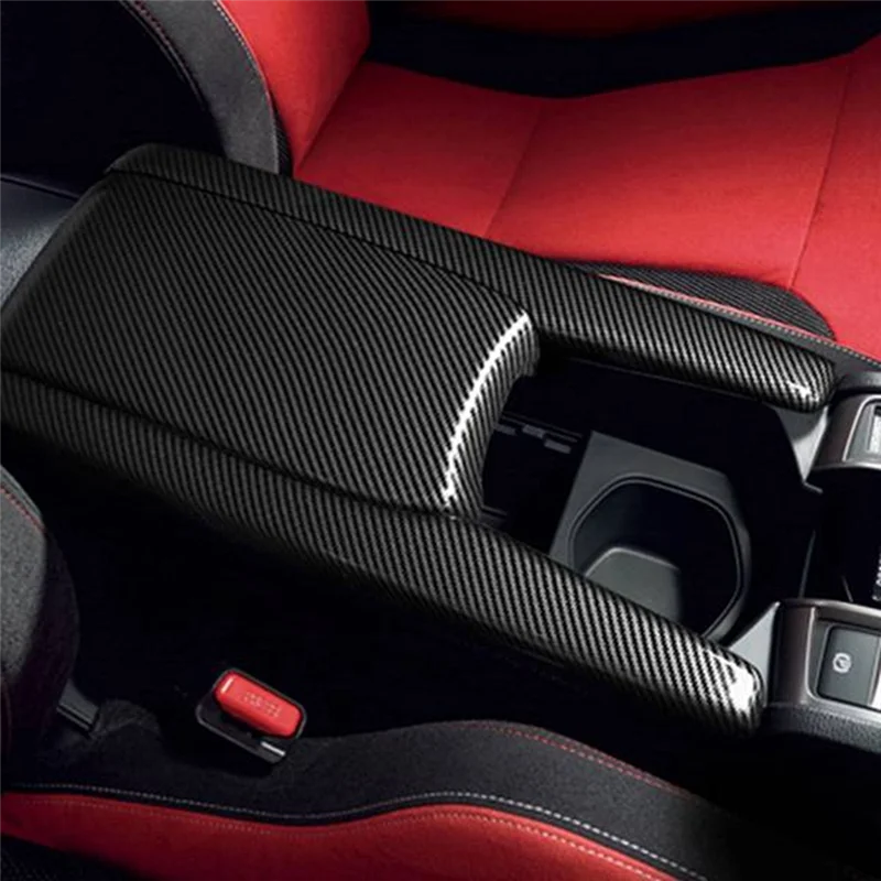 Interior view of a car with a black custom armrest box cover and red upholstery.