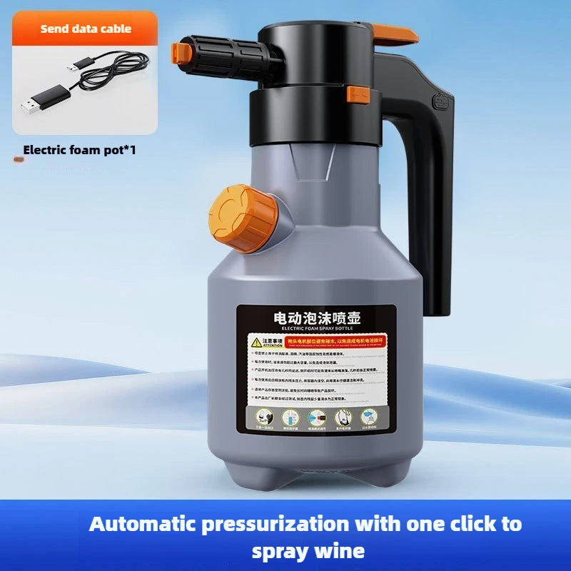 A gray electric foam spray bottle with an orange nozzle and a black data cable, designed for automatic pressurization.