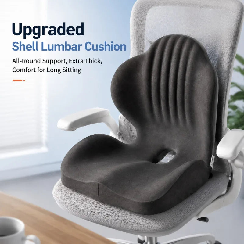Gray ergonomic shell lumbar cushion placed on a white office chair for long sitting comfort.