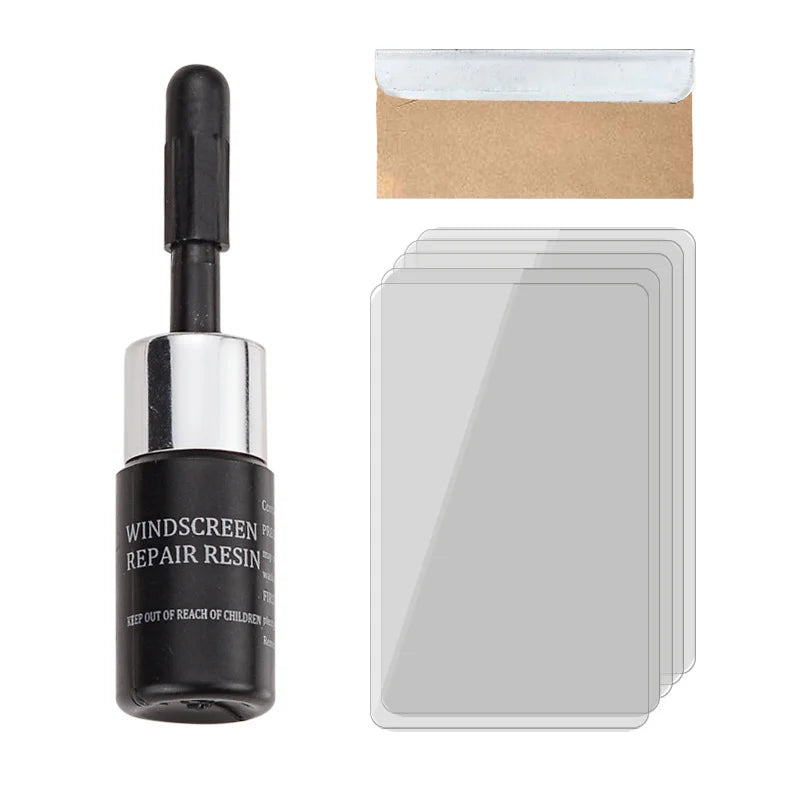 A black bottle of Windscreen Repair Resin next to a piece of kraft paper and a clear plastic repair sheet.