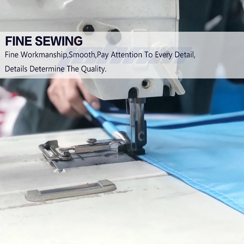 Close-up of a hand sewing a blue fabric using a sewing machine, demonstrating fine sewing craftsmanship.