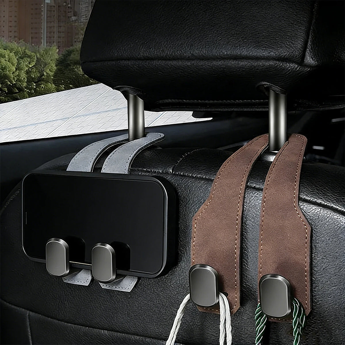 Black leather car seat headrest hooks with attached smartphone holder and strap
