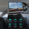 A triple-lens dash cam mounted on a car windshield, displaying a daytime view of a road.
