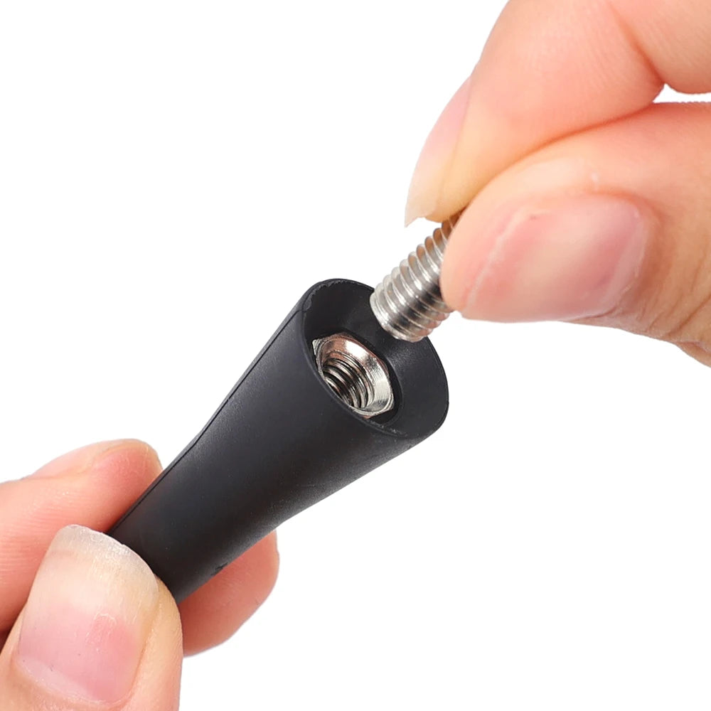 A hand is installing a universal car roof antenna onto a device.
