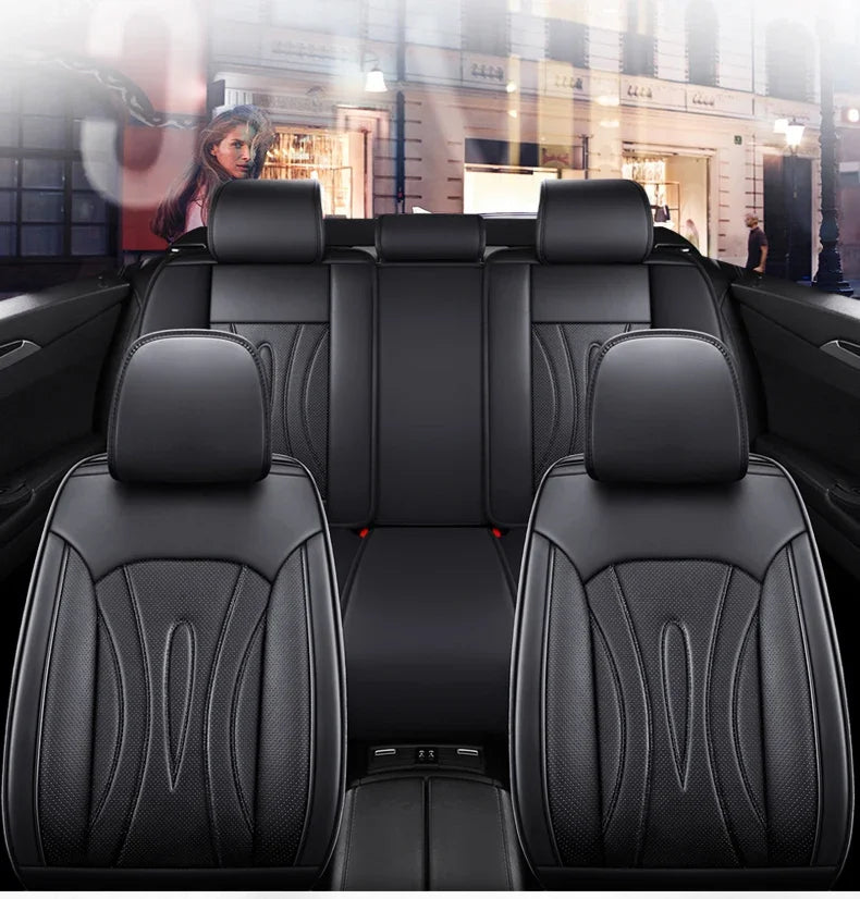 Interior view of a luxury car with black leather seat covers and a person visible through the window.