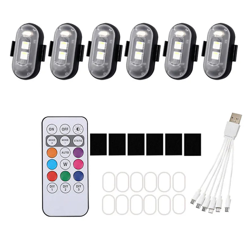 Set multifunktionale LED-Stroboskoplichter für Fahrzeuge und Drohnen, inklusive Fernbedienung und mehrere Leuchten.