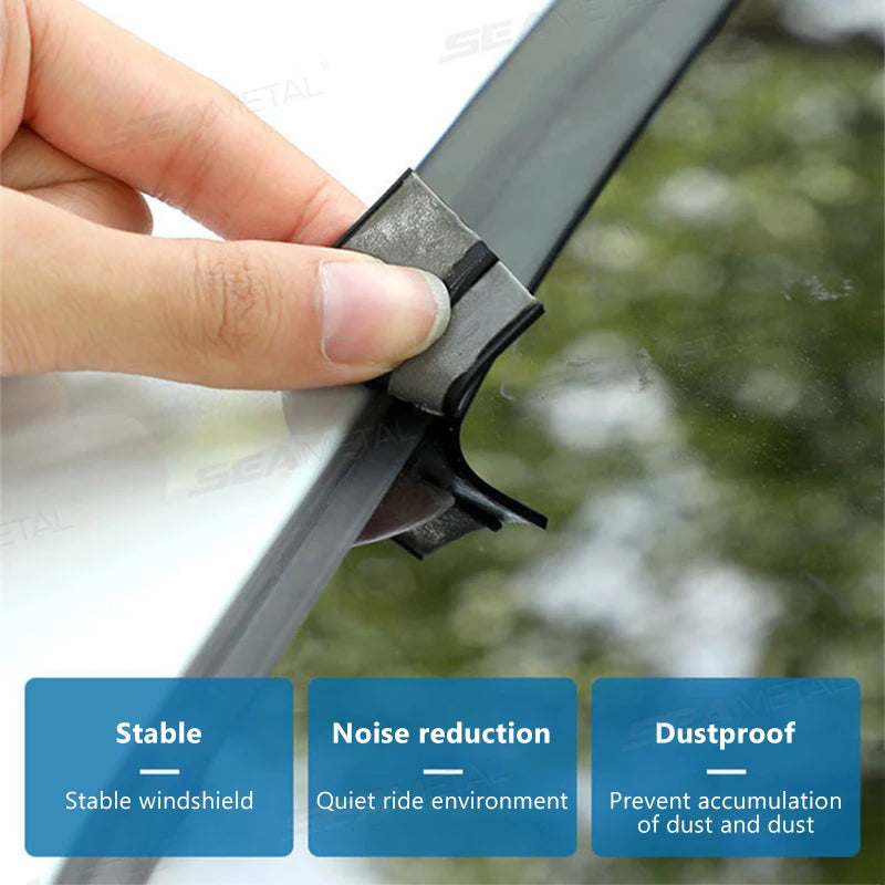 A hand is installing a durable car weather strip for windshield sealing on a vehicle.