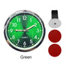 A green quartz stick-on car clock face with hands and a separate mounting piece.