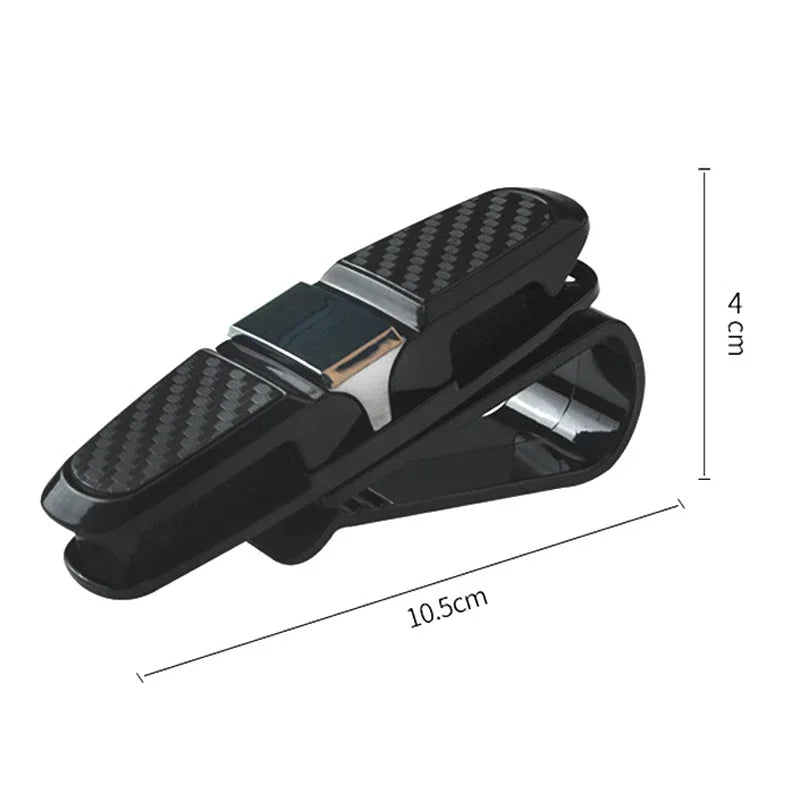 Black universal car glasses holder clip designed to secure sunglasses and eyeglasses.