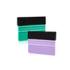 A set of three felt squeegee tools in black, green, and purple for removing vinyl decals and film.