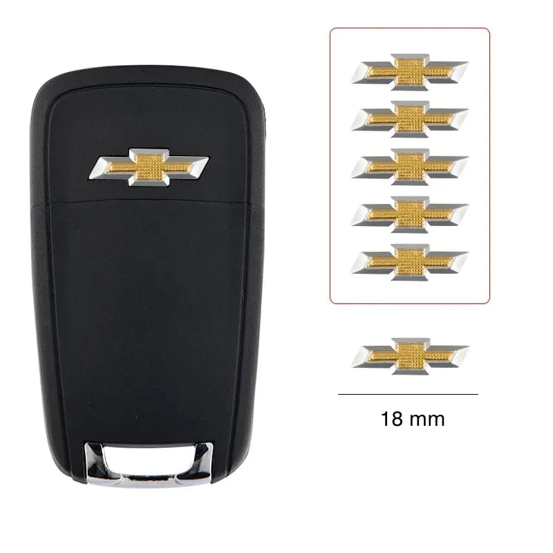 Black key fob with multiple aluminum Chevrolet key emblem stickers and a 18 mm measurement.