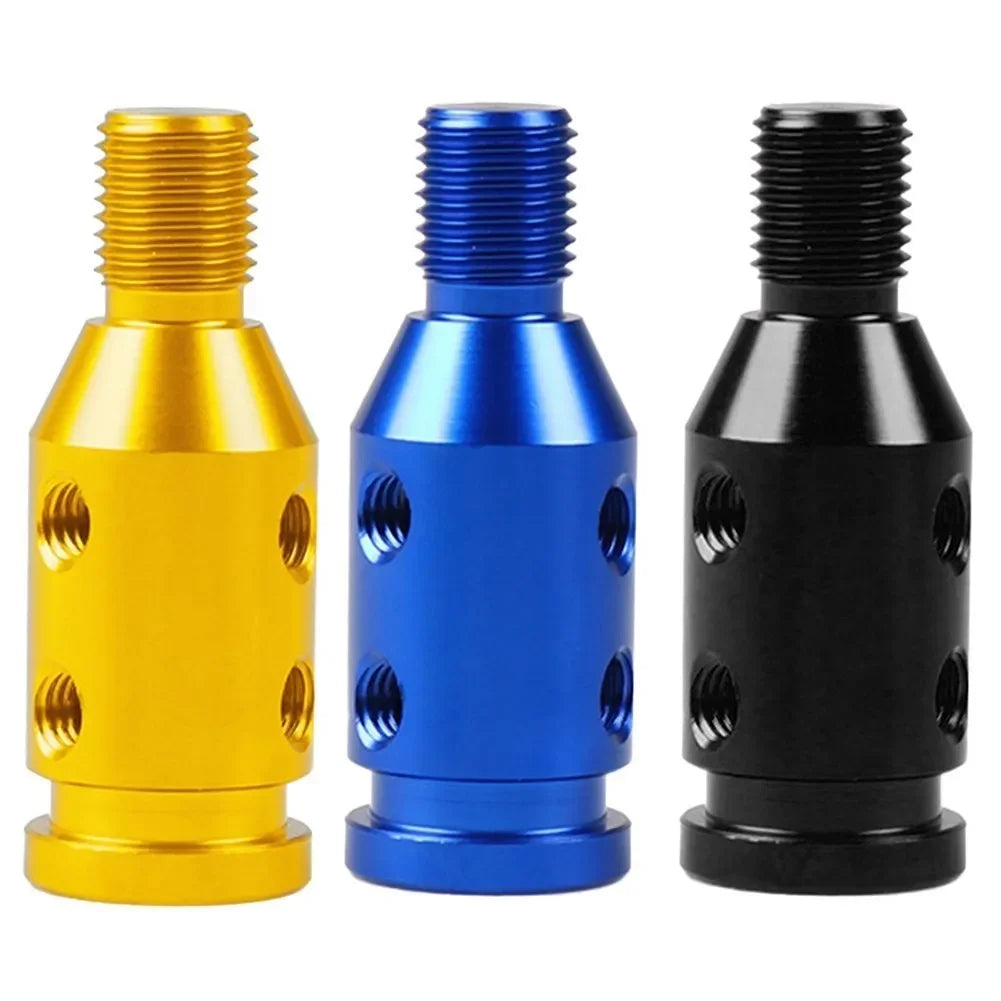 Three universal gear shift knob adapters in gold, blue, and black finishes.