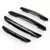 A set of four black car door edge protector strips for anti-scratch guard trim.