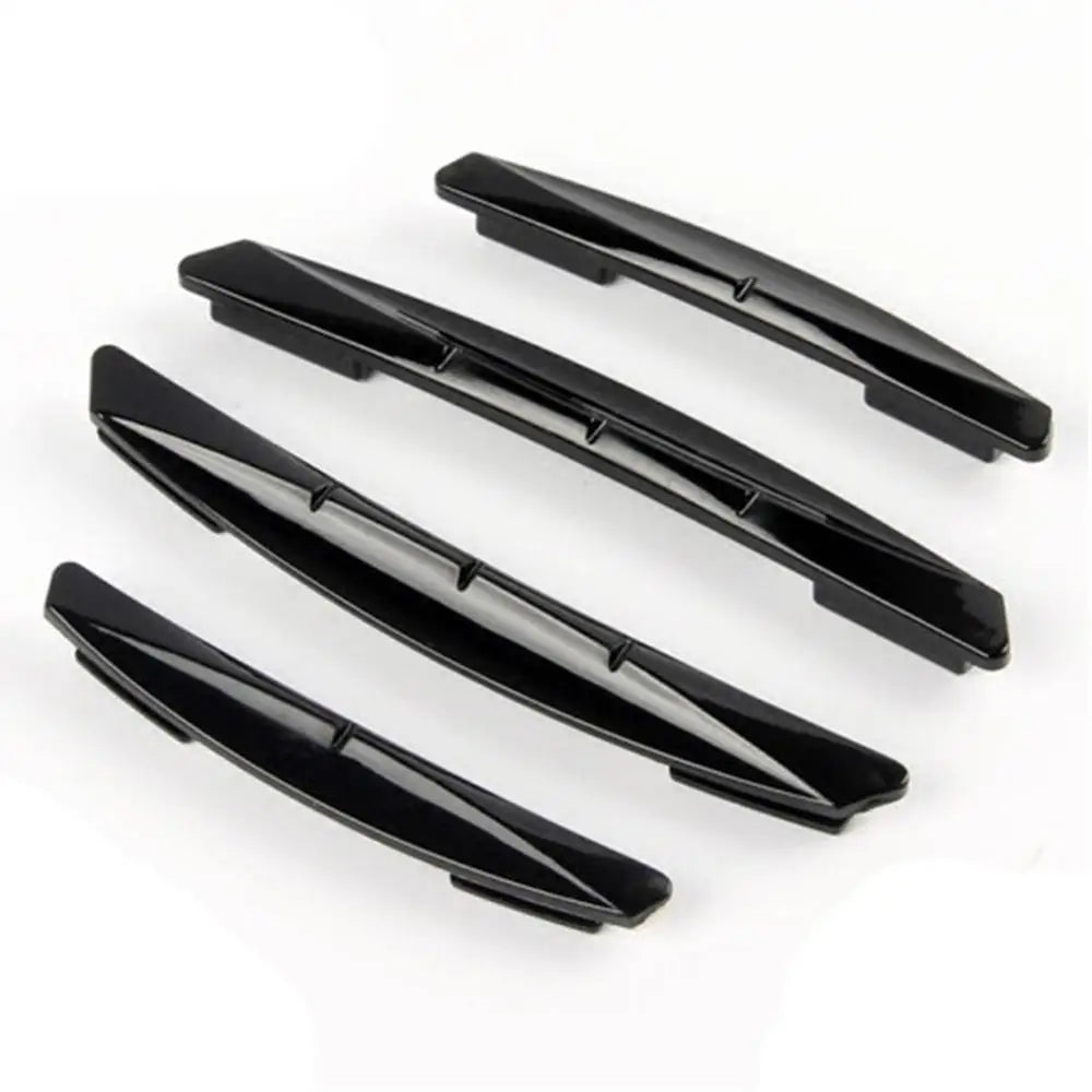 A set of four black car door edge protector strips for anti-scratch guard trim.