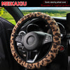 Leopard print plush steering wheel cover installed in a car interior.