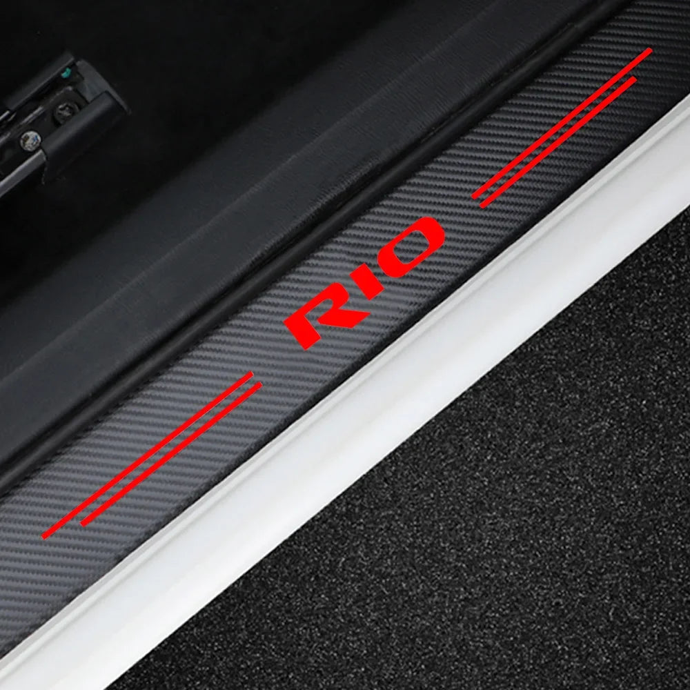 Close-up view of carbon fiber door threshold decals with red lines indicating the placement.
